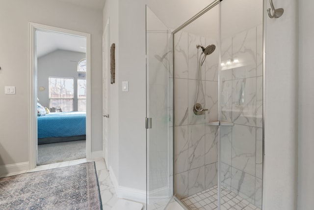 bathroom with vaulted ceiling and a shower with door