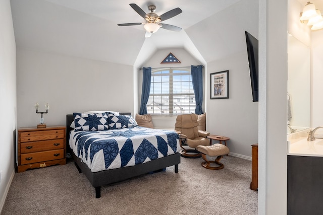 bedroom featuring light colored carpet, vaulted ceiling, and ceiling fan