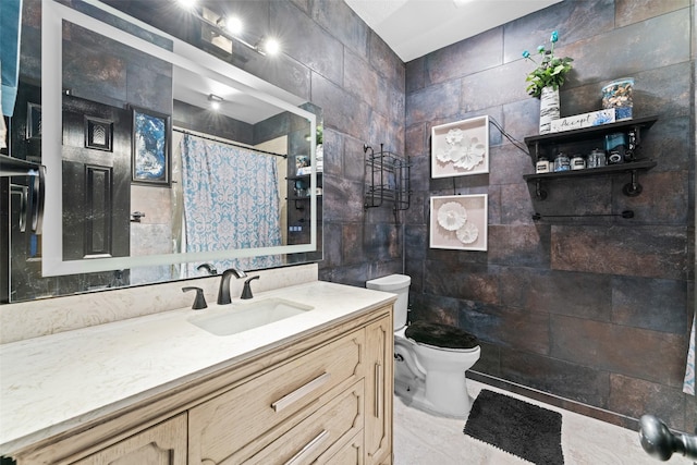 bathroom featuring vanity, toilet, tile walls, and curtained shower