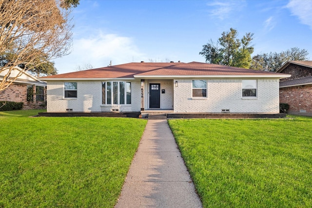 ranch-style home with a front lawn