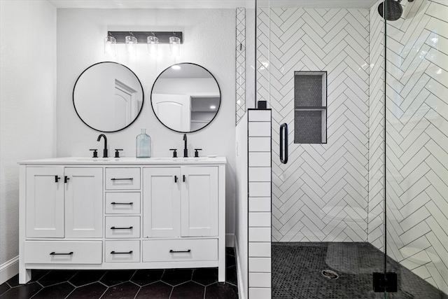 bathroom with tile patterned floors, vanity, and a shower with shower door