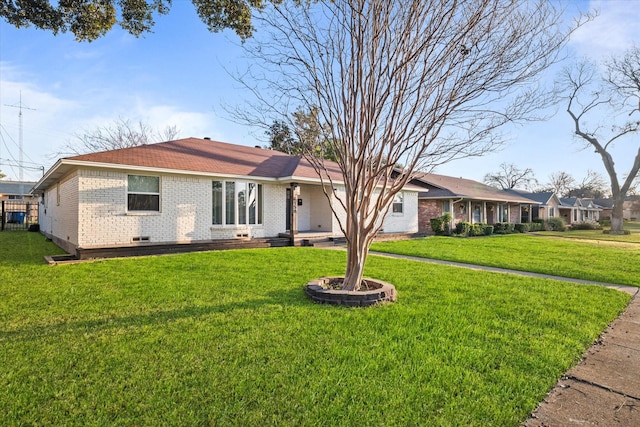 ranch-style house with a front lawn