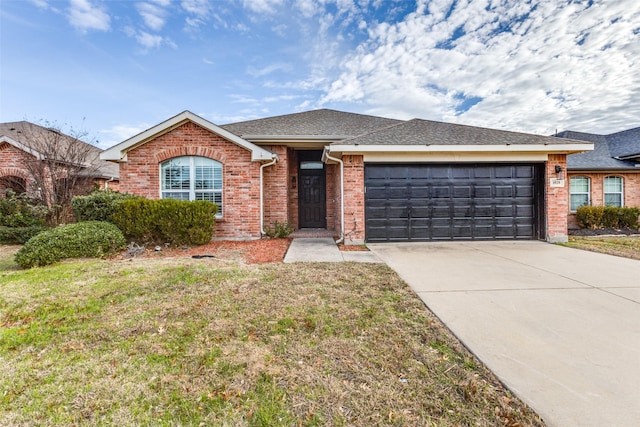 single story home with a garage and a front yard