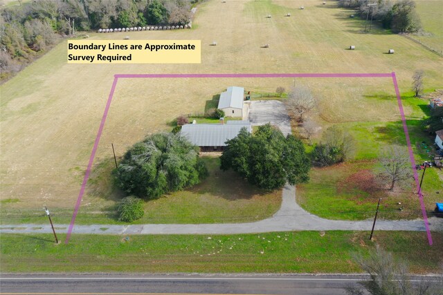 birds eye view of property featuring a rural view