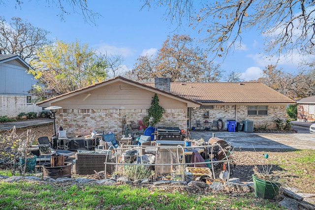 rear view of house featuring a patio area