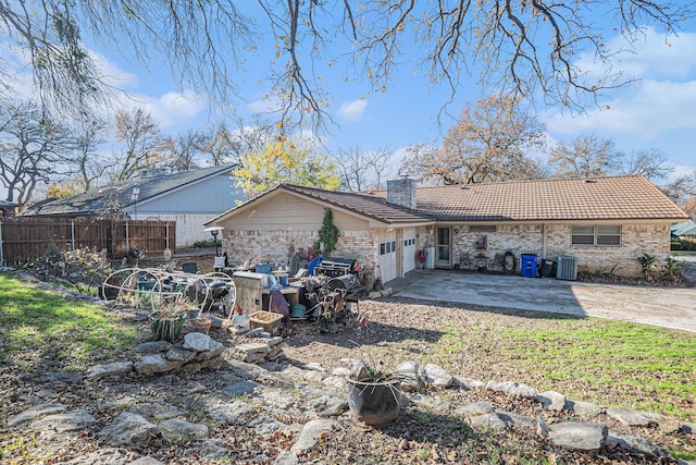 rear view of house featuring a patio area and cooling unit