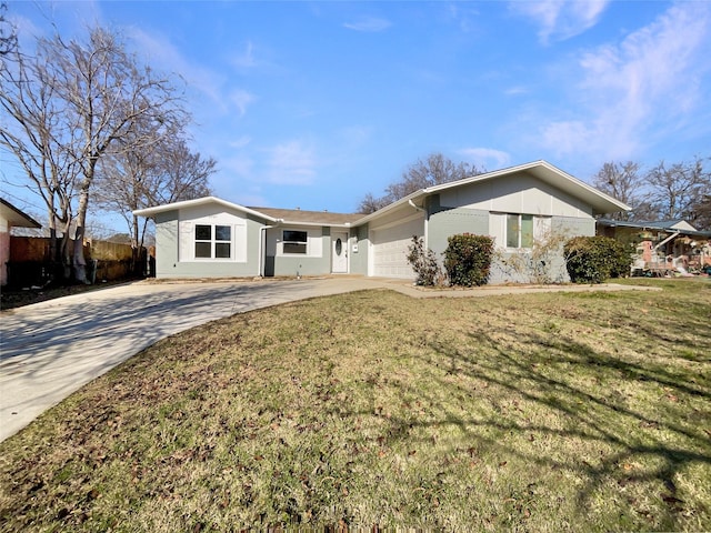 ranch-style home featuring a garage and a front lawn