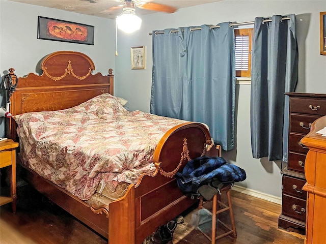 bedroom featuring ceiling fan and dark wood-type flooring