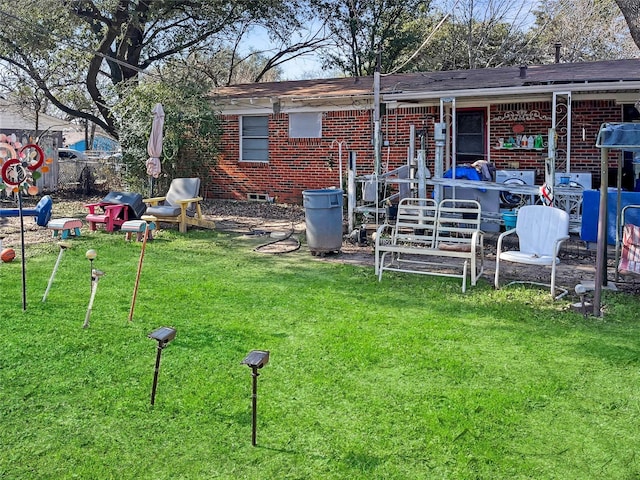 back of house featuring a lawn