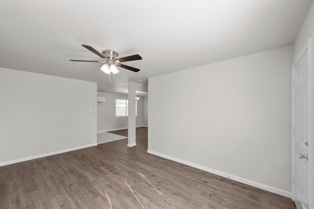 empty room featuring ceiling fan and wood-type flooring