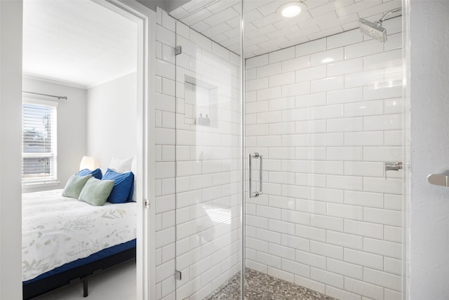 bathroom featuring crown molding and walk in shower