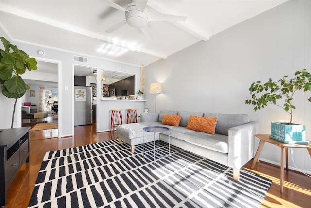 living room with beam ceiling, ceiling fan, and dark wood-type flooring