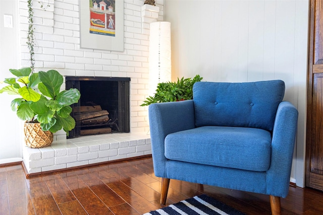 sitting room with dark hardwood / wood-style flooring and a fireplace