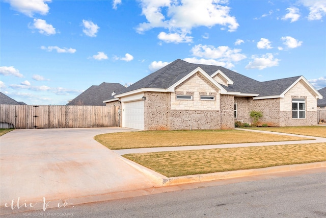 view of front facade with a garage and a front lawn