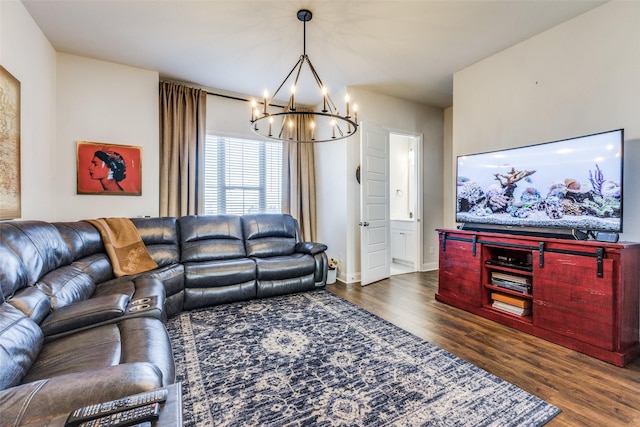 living room featuring dark hardwood / wood-style floors and a notable chandelier