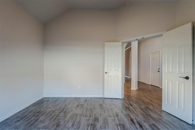 spare room featuring high vaulted ceiling