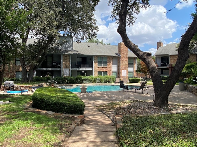 view of pool featuring a patio