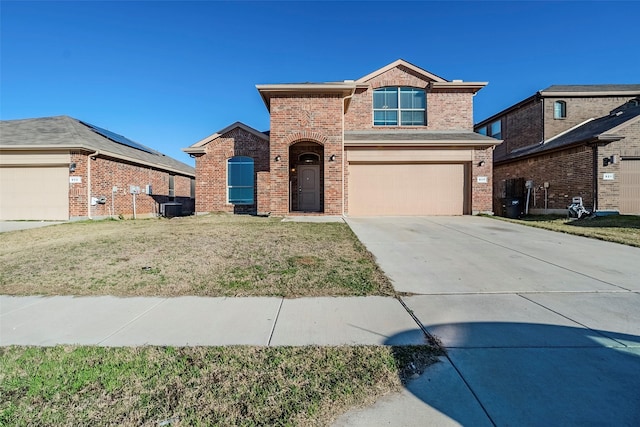 front of property featuring a front yard and a garage