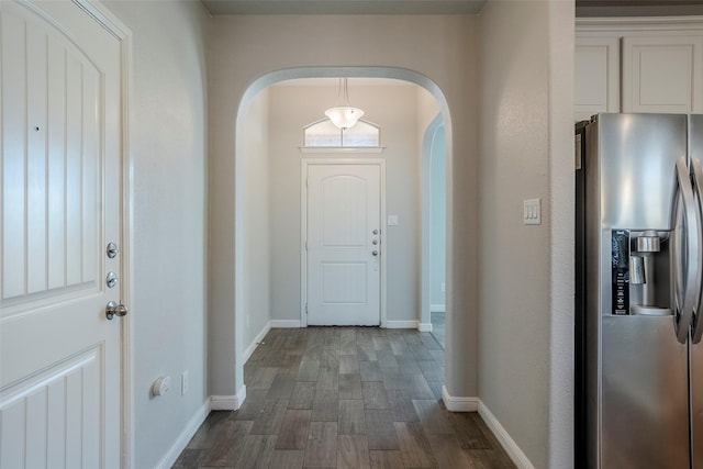 entryway with dark hardwood / wood-style floors