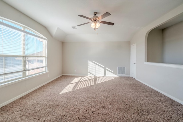 empty room with ceiling fan, carpet, and lofted ceiling