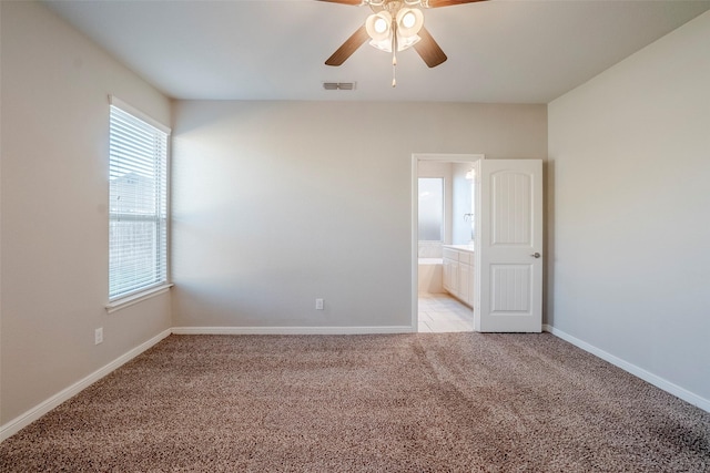 carpeted empty room with ceiling fan