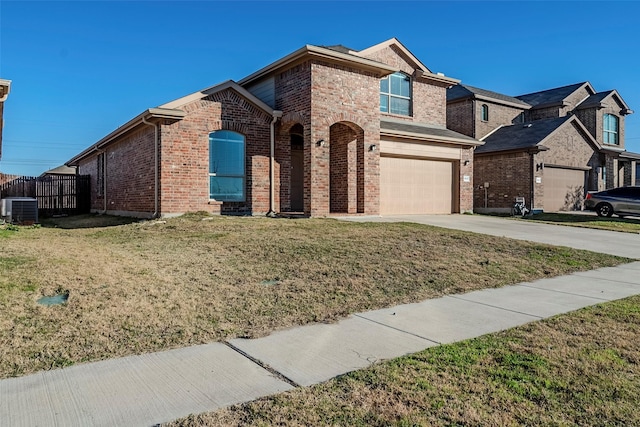 view of front of property featuring cooling unit, a front yard, and a garage