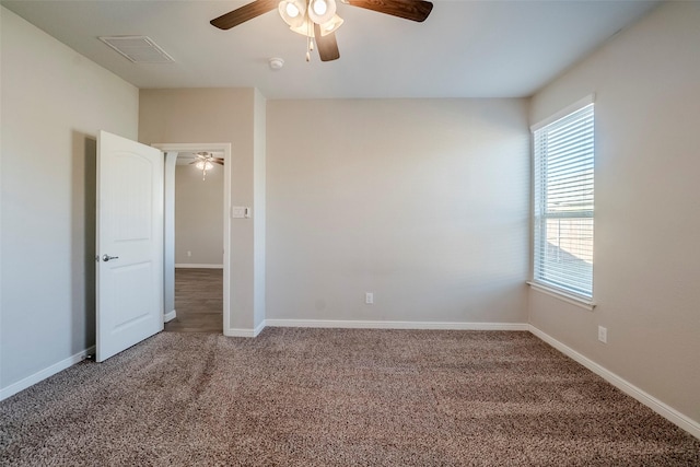 unfurnished room featuring ceiling fan and carpet