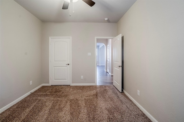 unfurnished bedroom with carpet and ceiling fan