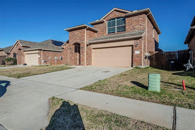 view of front facade with a garage and a front yard