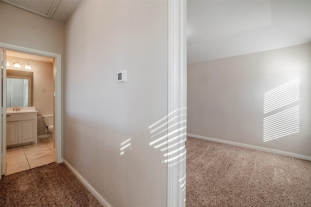 corridor with light colored carpet