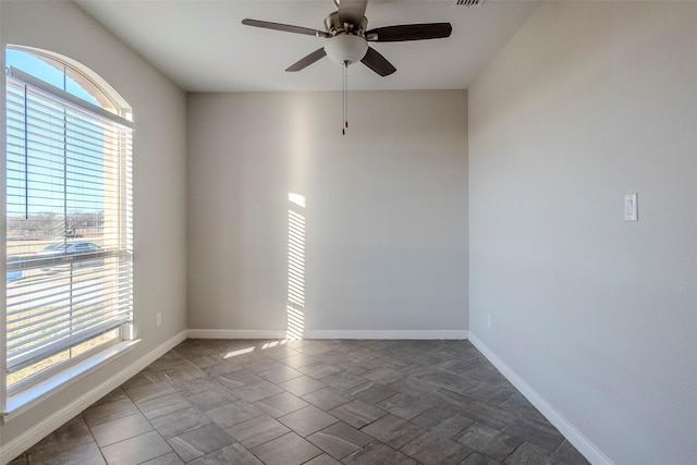 unfurnished room with ceiling fan