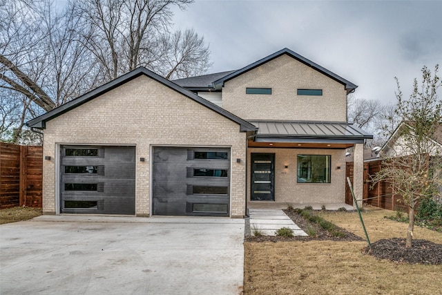 view of front facade with a porch and a garage