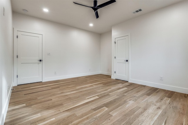 spare room with light hardwood / wood-style floors and ceiling fan