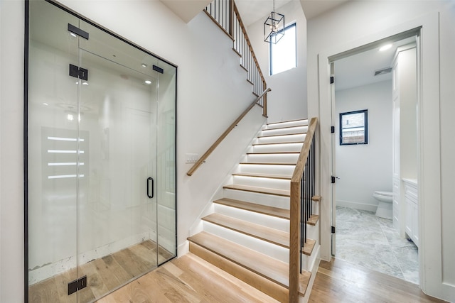 stairway featuring hardwood / wood-style floors