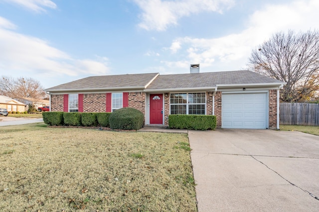 ranch-style house with a garage and a front lawn