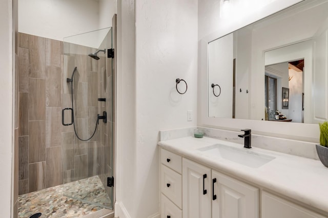 bathroom with vanity and walk in shower