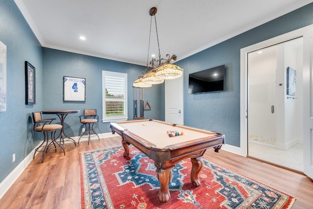 rec room with wood-type flooring, crown molding, and pool table