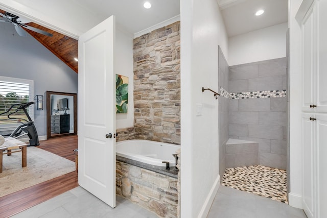 bathroom with separate shower and tub, ceiling fan, tile patterned flooring, and vaulted ceiling