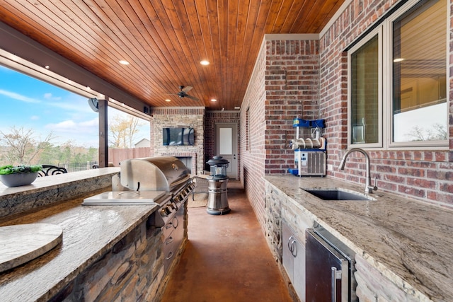10794 County Road 334, Tyler, TX 75708 - view of patio / terrace with fence, ceiling fan, grilling area, a sink, and an outdoor kitchen