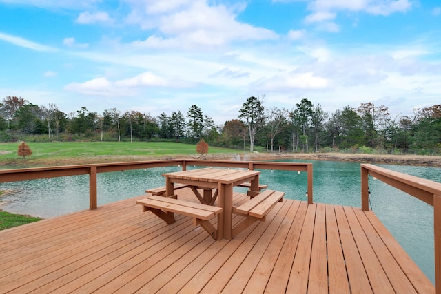 view of dock with a deck with water view