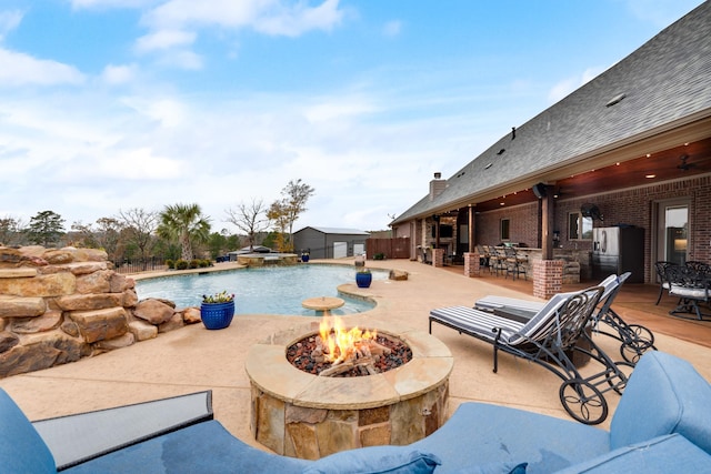 10794 County Road 334, Tyler, TX 75708 - view of pool featuring an outdoor fire pit, ceiling fan, a pool with connected hot tub, and a patio area
