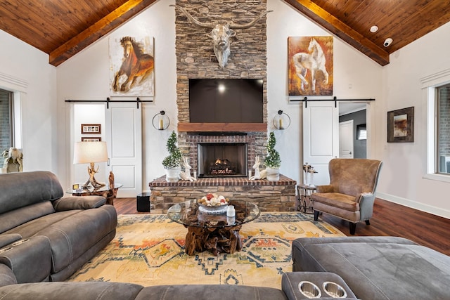 10794 County Road 334, Tyler, TX 75708 - living room with a barn door, wood finished floors, and wood ceiling