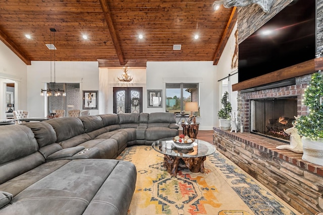 10794 County Road 334, Tyler, TX 75708 - living room featuring high vaulted ceiling, wood finished floors, a chandelier, and wood ceiling