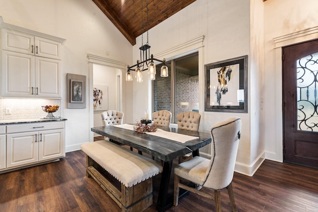 10794 County Road 334, Tyler, TX 75708 - dining room with dark wood-style floors, high vaulted ceiling, wooden ceiling, and baseboards