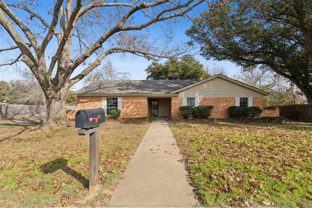 ranch-style house with a front yard