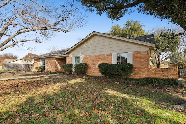 view of property exterior featuring a lawn