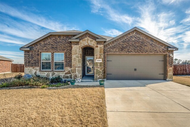 view of front of property featuring a garage