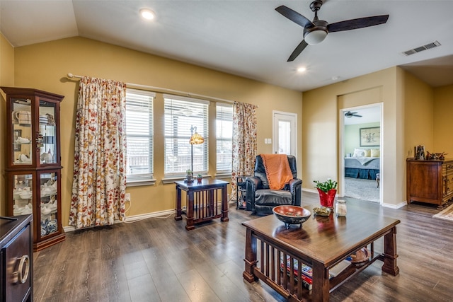 living room featuring vaulted ceiling and dark wood-type flooring