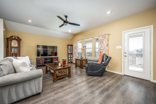 living room featuring ceiling fan, wood-type flooring, and vaulted ceiling