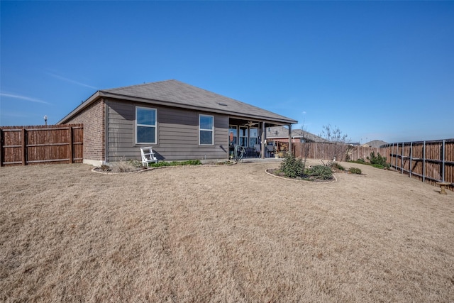 back of property with a patio